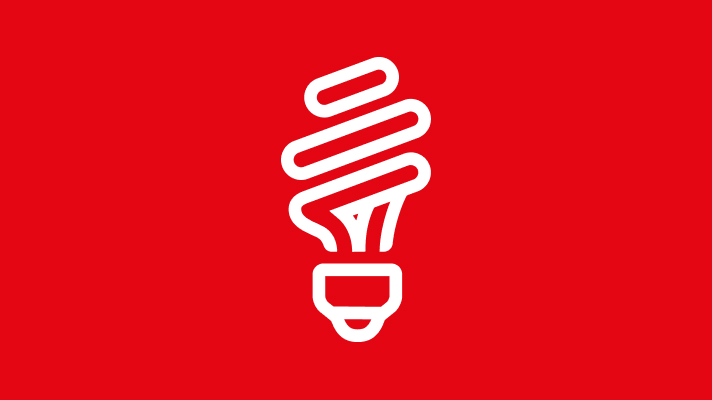 Na sliki je ikona bele varčne sijalke v obliki spiralne žarnice. Ozadje je enotne rdeče barve.