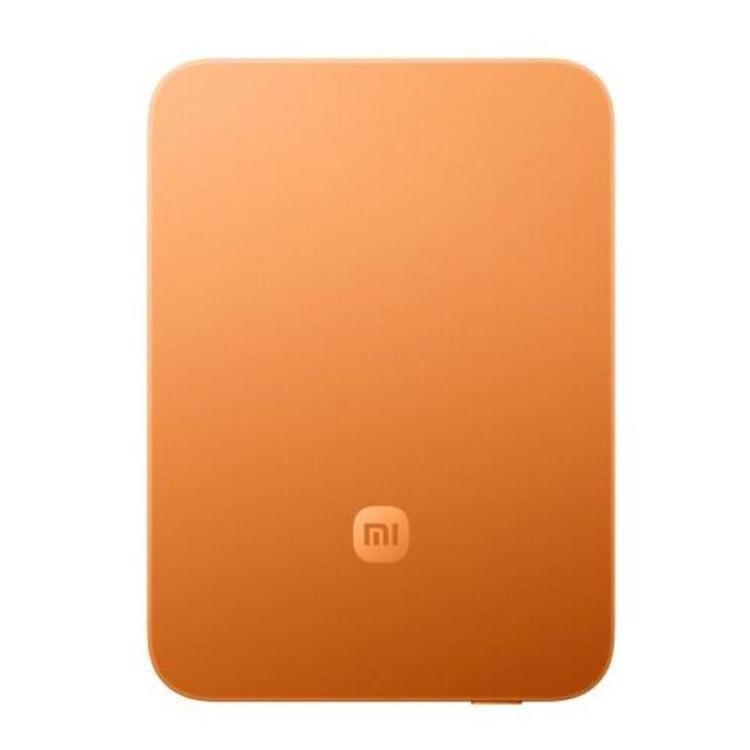 Prenosna baterija Xiaomi Ultra Thin Magnetic 15W 5000 GL, oranžna, s tankim ohišjem in magnetnim pritrjevanjem.