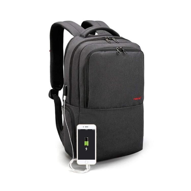 Temno siv nahrbtnik Tigernu za prenosnike do velikosti 15,6" (diagonala) z več predelki na zadrgo, USB izhodom za polnjenje in oblazinjenimi naramnicami nudi praktično in varno shranjevanje za vsakodnevno uporabo.