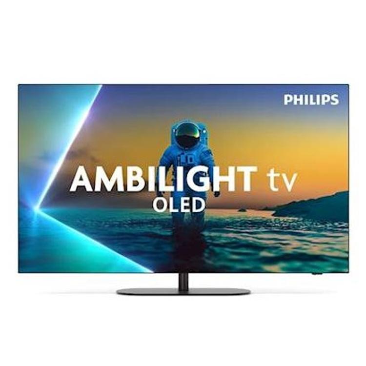 Philips Ambilight OLED TV: raven zaslon, astronaut nad morjem ob sončnem zahodu, svetlobni Ambilight rob.