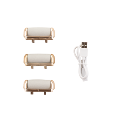 Trije nadomestni brusilni valji različnih grobosti in bel USB-kabel za polnjenje.