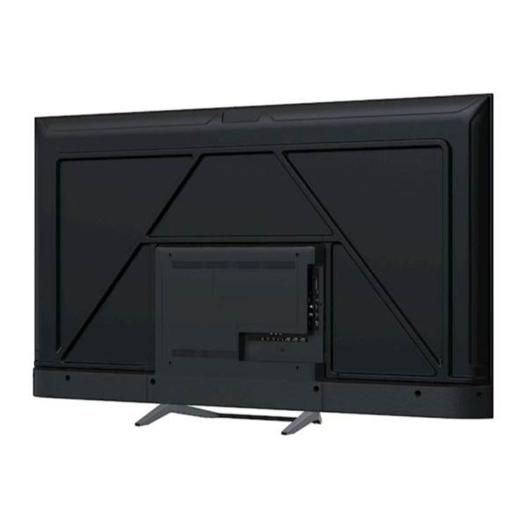 Zadnja stran TV Haier s sredinskim priključnim modulom in kovinskim stabilnim stojalom.