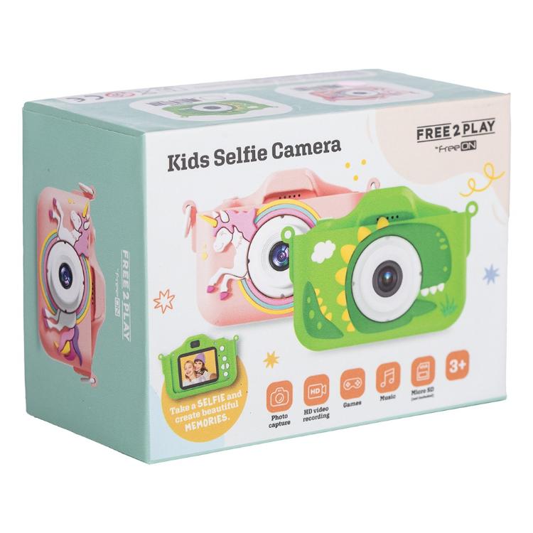 Embalaža otroškega digitalnega fotoaparata FreeON Free2Play z motivom dinozavra in prikazom funkcije za selfije.