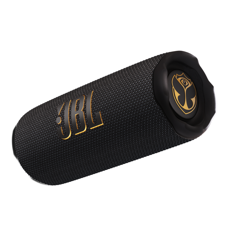 JBL prenosni Bluetooth zvočnik črne barve s kovinsko zlatim logotipom Tomorrowland ob strani.