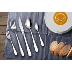 Cheffino Bianca jedilni pribor pogrnjen na mizi ob krožniku juhe in kruhu.